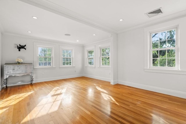 12 Moreland Rd, Quincy, MA 02169 - unfurnished room featuring plenty of natural light, crown molding, light wood-style floors, and recessed lighting