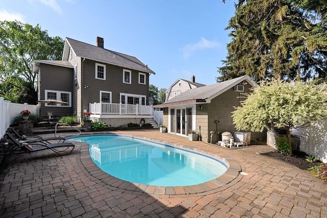 12 Moreland Rd, Quincy, MA 02169 - view of swimming pool with an outbuilding, a wooden deck, a patio area, and a fenced backyard