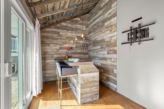 12 Moreland Rd, Quincy, MA 02169 - dining space featuring wood walls, wood finished floors, and lofted ceiling