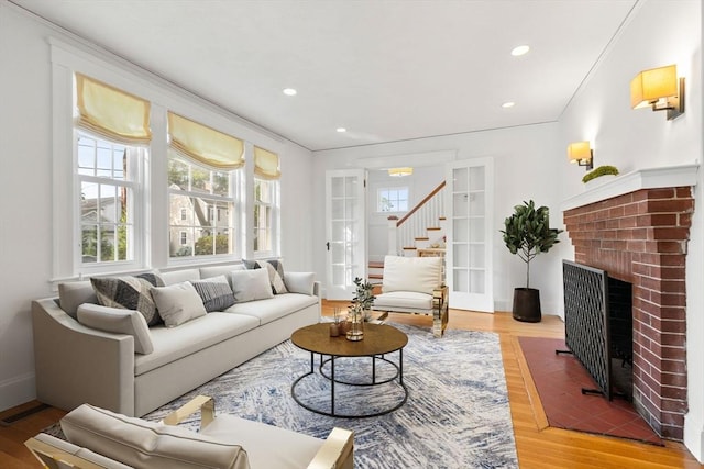 12 Moreland Rd, Quincy, MA 02169 - living area featuring a brick fireplace, wood finished floors, recessed lighting, and crown molding