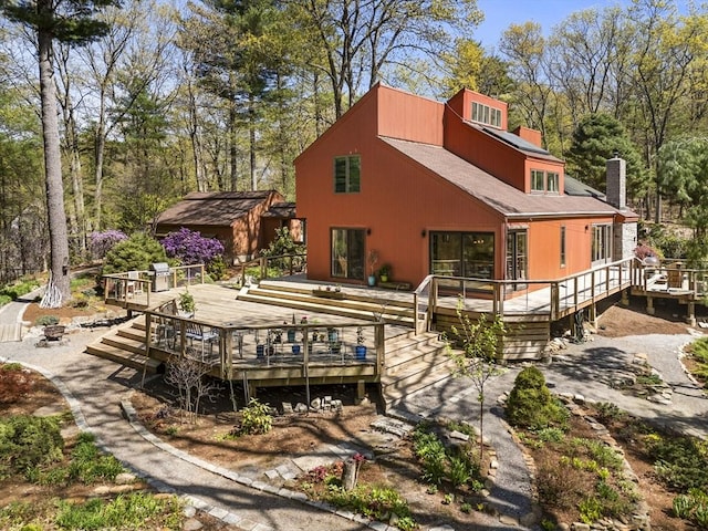 11 Chaplin Cir, Boxford, MA 01921 - rear view of property featuring a chimney, a deck, and view of wooded area