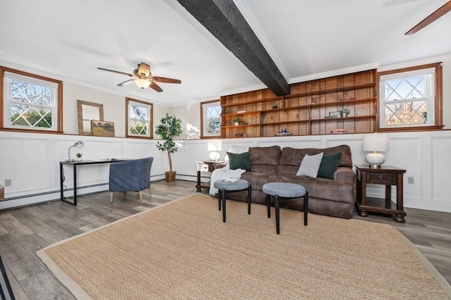 living room featuring ornamental molding, plenty of natural light, and hardwood / wood-style floors