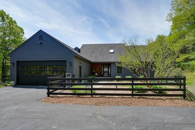 161 Randall Rd, Berlin, MA 01503 - view of front facade featuring a garage, asphalt driveway, and a fenced front yard