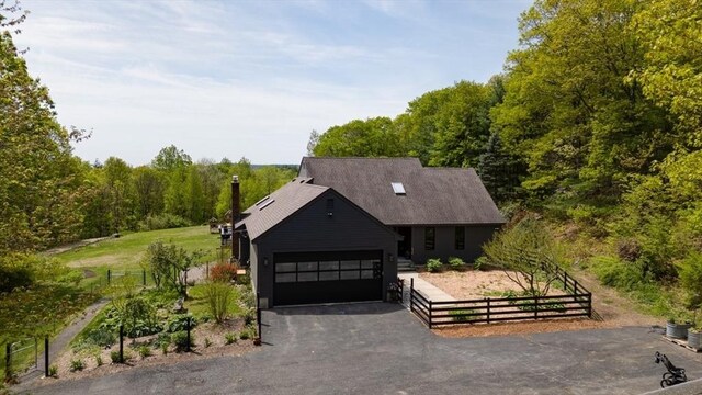 161 Randall Rd, Berlin, MA 01503 - view of front of home with fence, asphalt driveway, and an attached garage