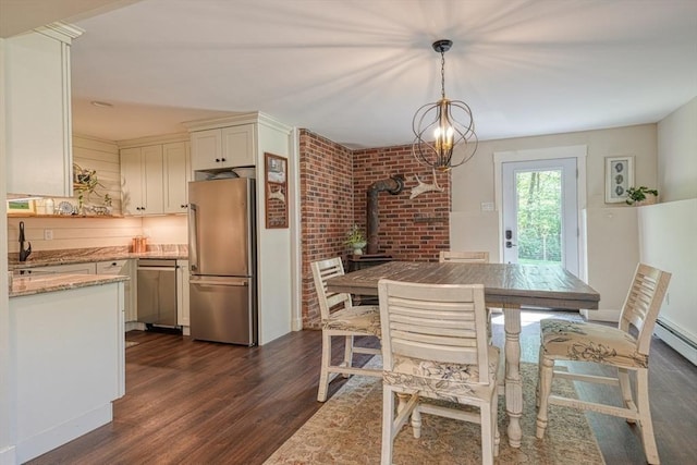 161 Randall Rd, Berlin, MA 01503 - dining room featuring a wood stove and dark wood finished floors
