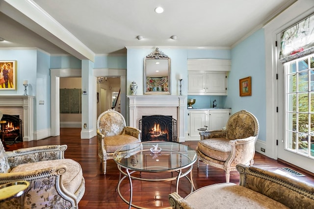 living room featuring crown molding and dark wood-type flooring