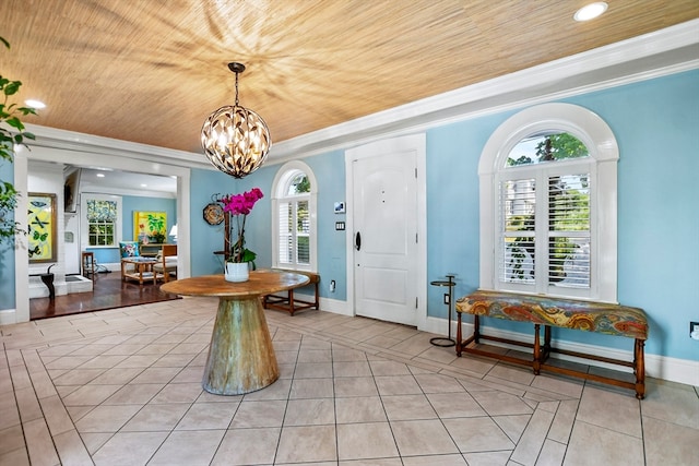 dining area featuring wood ceiling, light wood-type flooring, plenty of natural light, and crown molding