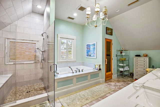 bathroom featuring an inviting chandelier, vaulted ceiling, independent shower and bath, and vanity