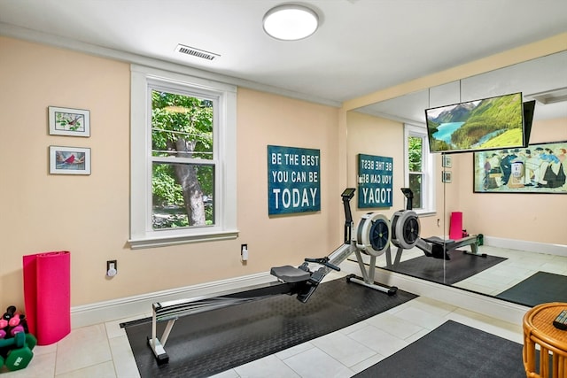 exercise area with light tile patterned floors