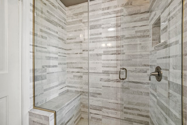 bathroom with a shower with shower door