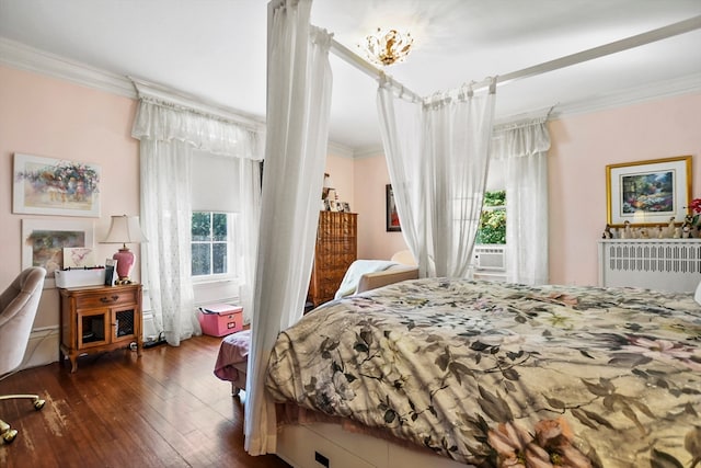 bedroom featuring dark hardwood / wood-style floors and ornamental molding