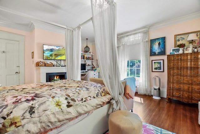 bedroom featuring ornamental molding and dark hardwood / wood-style floors