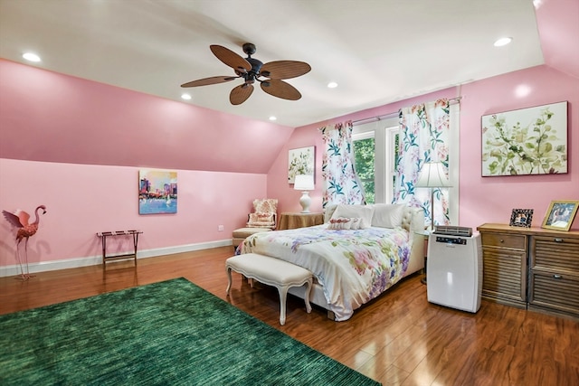 bedroom featuring wood-type flooring, vaulted ceiling, and ceiling fan