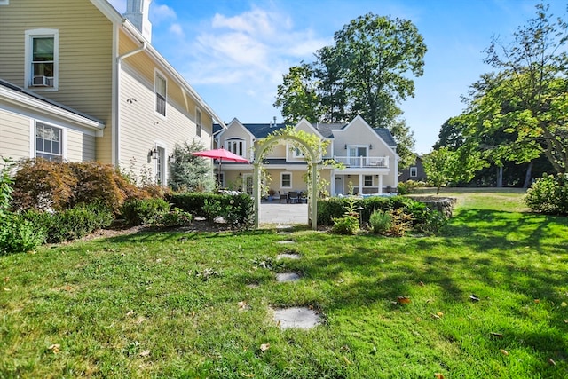 back of house with a lawn