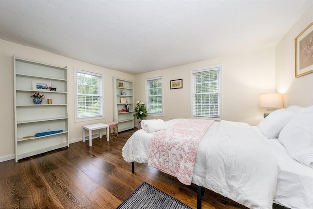 bedroom featuring dark hardwood / wood-style flooring