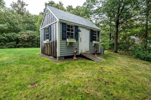 view of outdoor structure with a yard