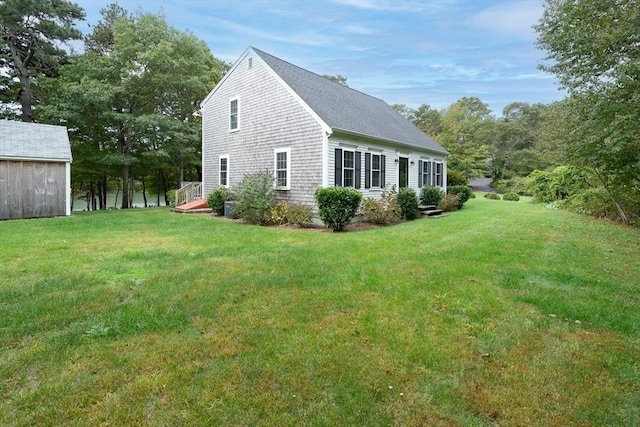 view of side of home featuring a yard