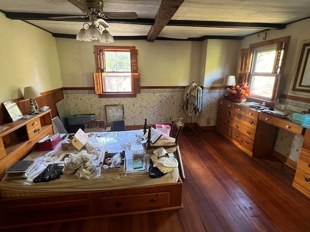 misc room featuring dark wood-type flooring, ceiling fan, and beam ceiling