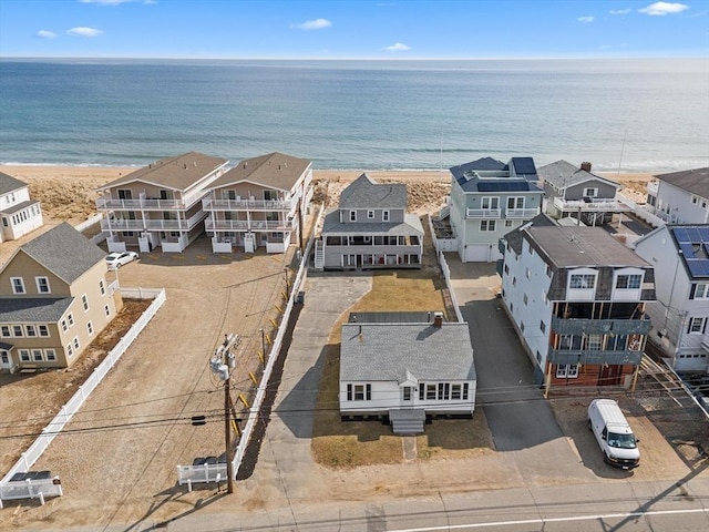 birds eye view of property featuring a residential view, a beach view, and a water view