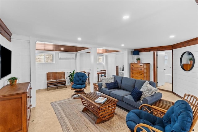 living area featuring recessed lighting and wooden walls