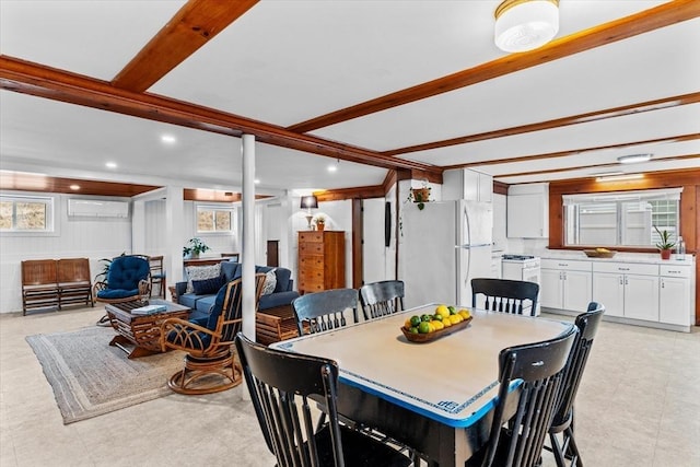 dining area featuring recessed lighting, beamed ceiling, and a wealth of natural light