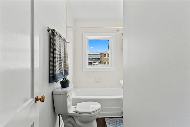 full bathroom featuring walk in shower, a bathtub, and toilet