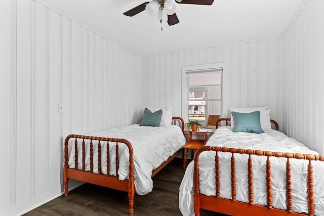 bedroom featuring a ceiling fan and wood finished floors