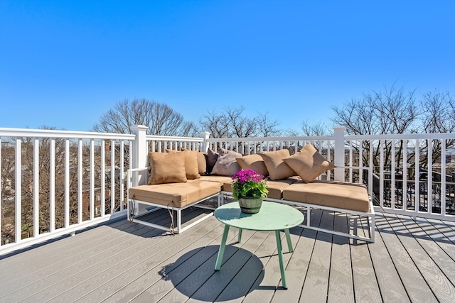 wooden deck featuring outdoor lounge area