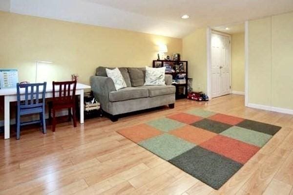 4 Emerson Gardens Rd Unit 4, Lexington, MA 02420 - living area with wood finished floors and recessed lighting