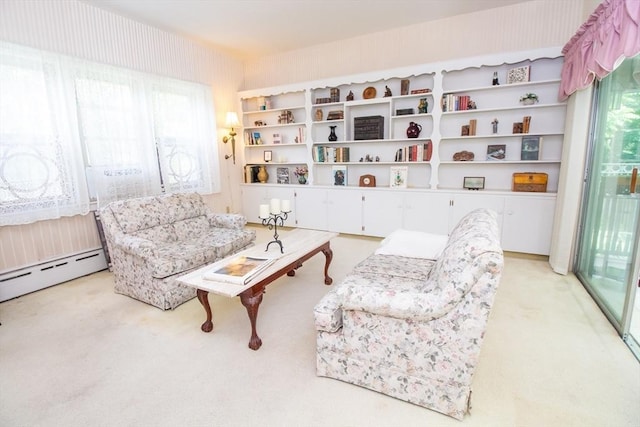 living area featuring carpet and baseboard heating