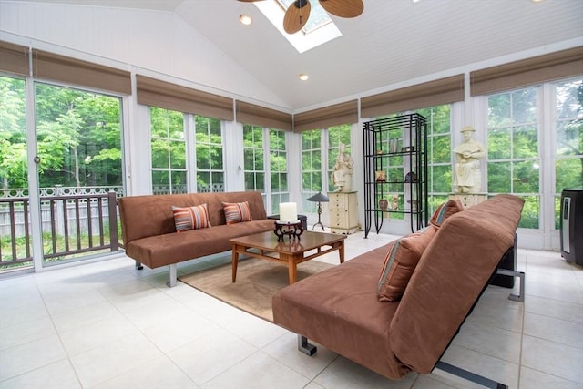 sunroom with lofted ceiling with skylight and ceiling fan