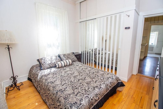 bedroom with hardwood / wood-style flooring