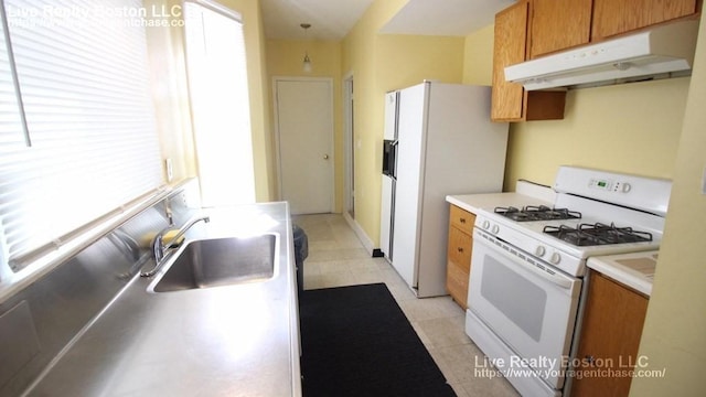 kitchen with sink and white appliances