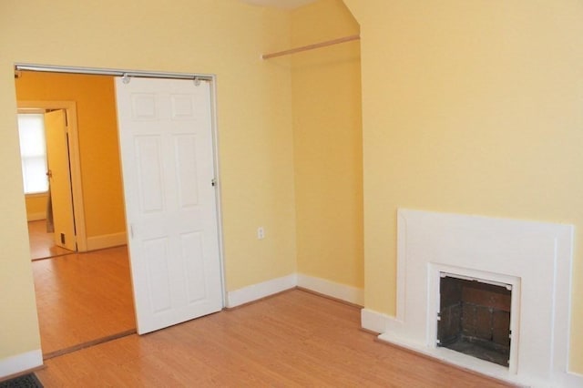 unfurnished living room featuring light wood-type flooring