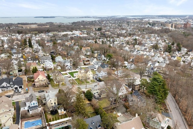 drone / aerial view featuring a residential view and a water view