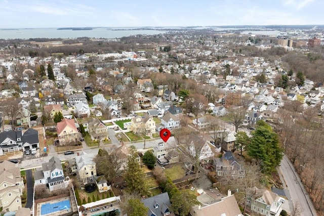 bird's eye view with a residential view and a water view