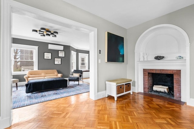 living room with a fireplace, a wall mounted air conditioner, and baseboards