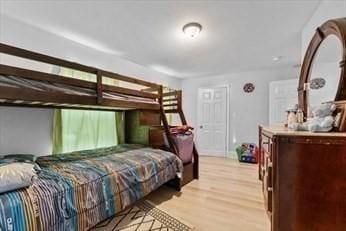 bedroom featuring light wood finished floors