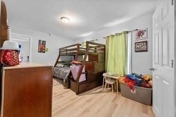 bedroom featuring light wood finished floors