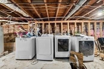 washroom featuring laundry area and separate washer and dryer