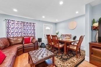 interior space with wood finished floors and recessed lighting
