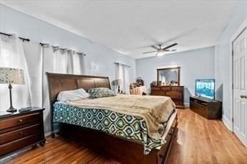 bedroom with ceiling fan and wood finished floors