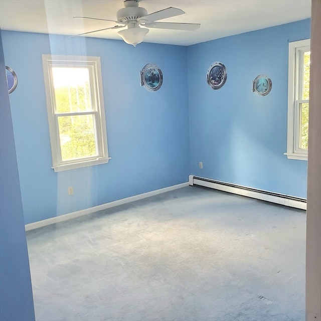 unfurnished room with ceiling fan, baseboard heating, and carpet