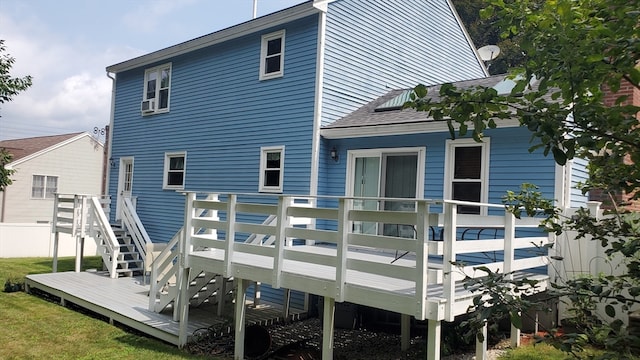 back of house with a wooden deck