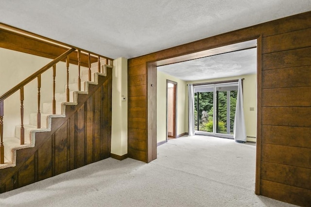 57 Strafford Rd, Westwood, MA 02090 - stairway with carpet flooring, baseboards, and a textured ceiling