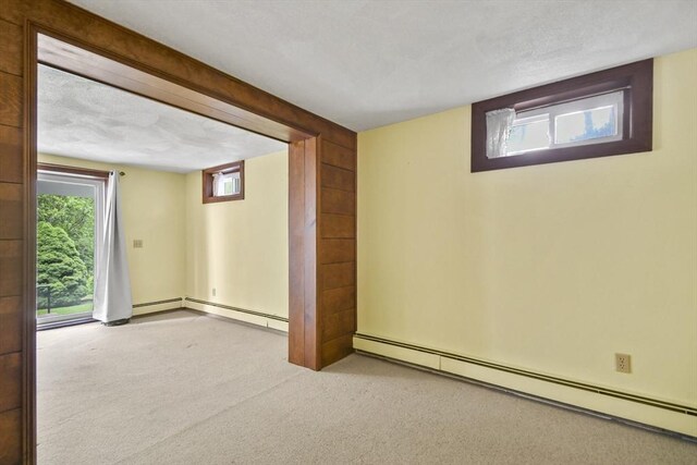 57 Strafford Rd, Westwood, MA 02090 - basement with a baseboard radiator and carpet