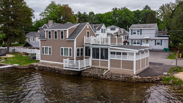 3 Lakeside Ave, Lunenburg, MA 01462 - rear view of property featuring a balcony, a chimney, a sunroom, and a water view