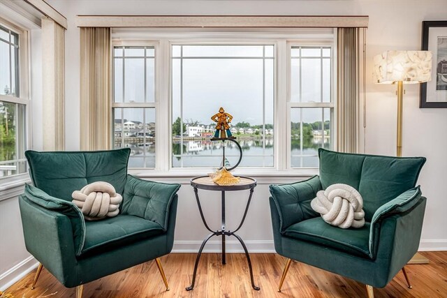 3 Lakeside Ave, Lunenburg, MA 01462 - sitting room with a water view, baseboards, and wood finished floors