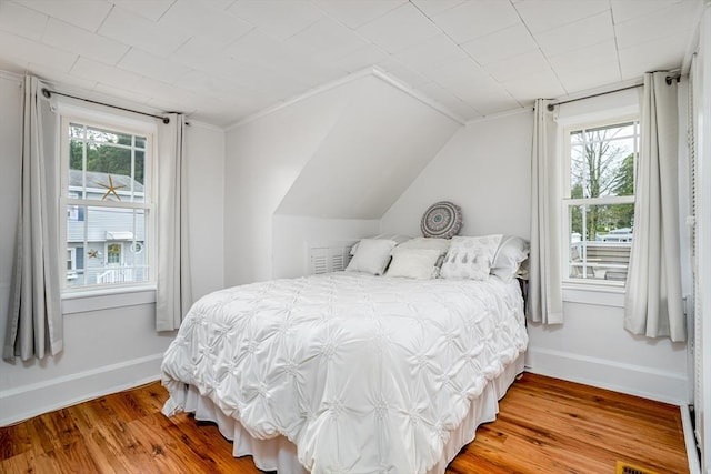 3 Lakeside Ave, Lunenburg, MA 01462 - bedroom with wood finished floors, baseboards, and lofted ceiling