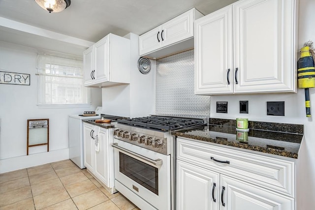 3 Lakeside Ave, Lunenburg, MA 01462 - kitchen featuring gas range, white cabinets, light tile patterned floors, and dark stone counters